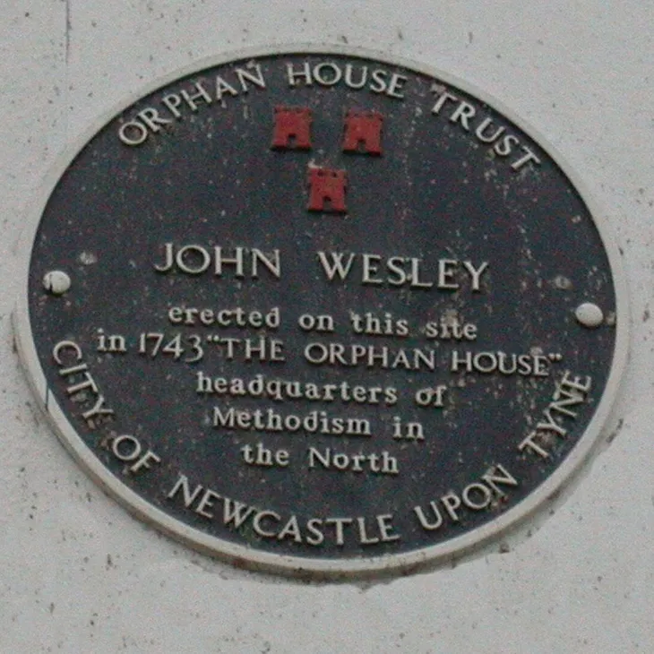 A circular heritage plaque for the Orphan House Trust