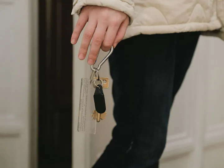 A hand holding a set of keys