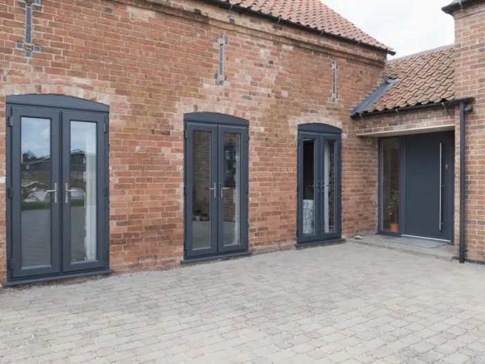 Flush sash French doors in dark grey