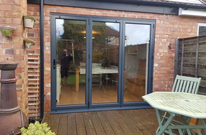 Black patio door with wood decking