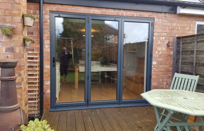 Black patio door with wood decking