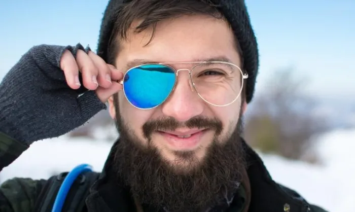 Man with broken sunglasses