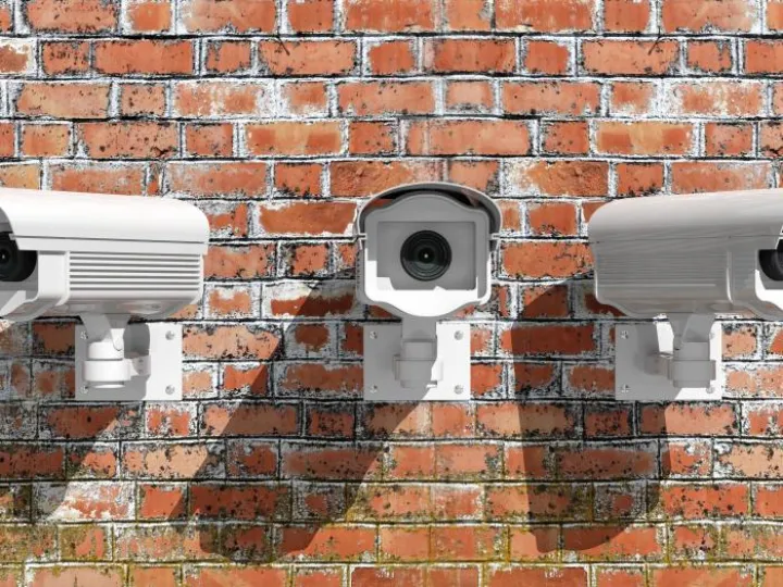 CCTV cameras on a brick wall