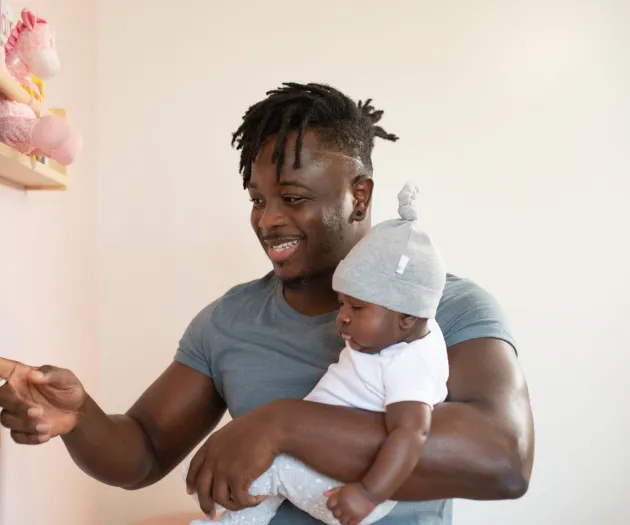 man-carrying-his-baby-3569597