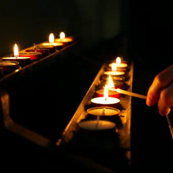 Lighting candles in church