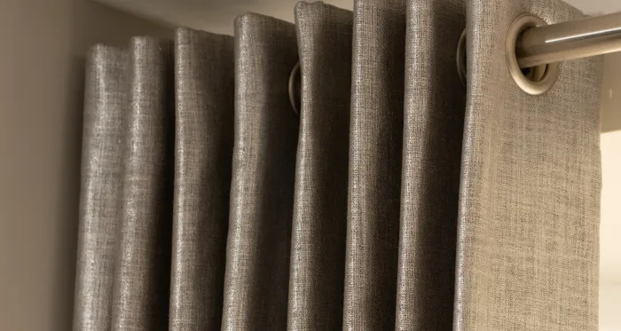 Eyelet curtains in grey