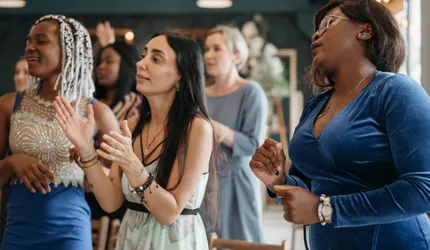A Group of Women Singing Together
