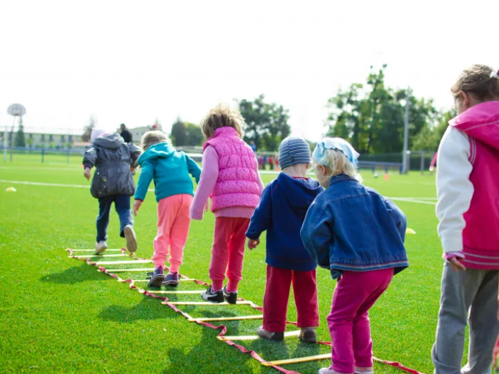 Children's Team Building on Green Grassland