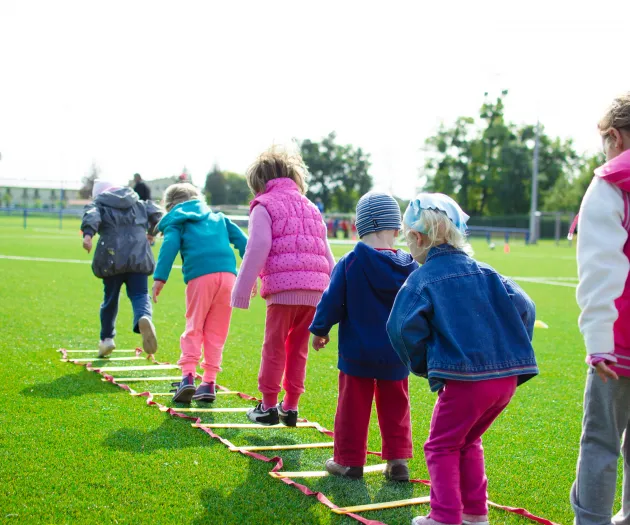 Children's Team Building on Green Grassland