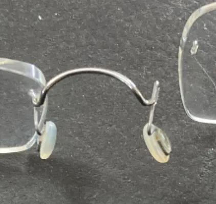Broken rimless glasses