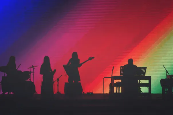 Band Members Playing On Stage