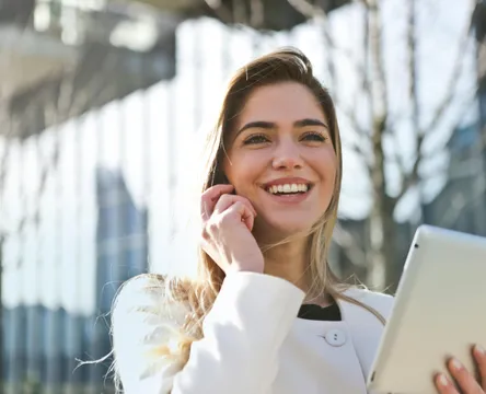 Woman In White Blazer Holding Tablet Computer