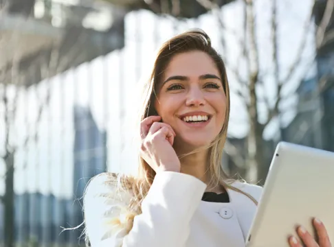 Woman In White Blazer Holding Tablet Computer