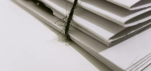 White Paper Folders With Black Tie