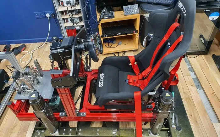 View of a motion rig platform with a black cockpit seat
