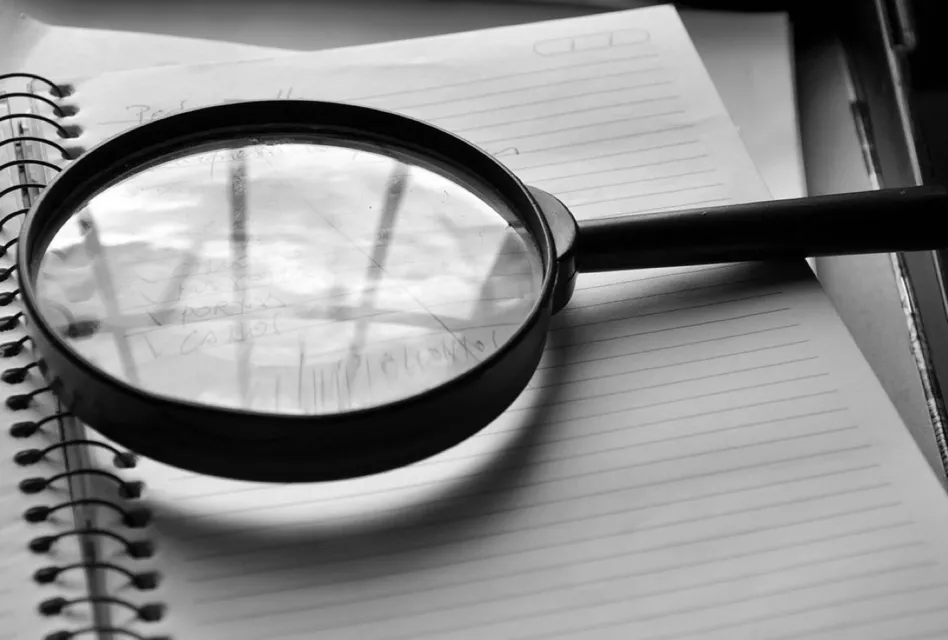 Magnifying glass, journal, detail