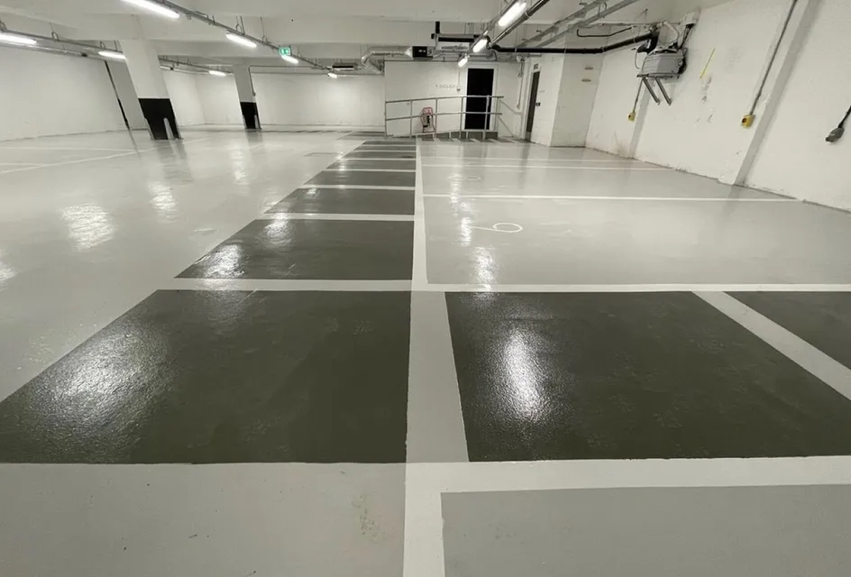 Glossy underground parking lot with marked spaces
