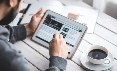 Man using stylus pen for touching the digital tablet screen