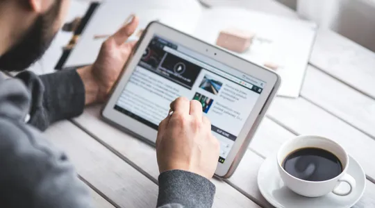 Man using stylus pen for touching the digital tablet screen