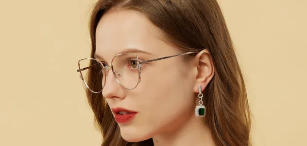 Woman in red wearing metal frame spectacles