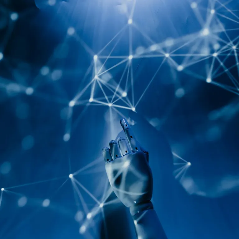 A robotic hand reaching into a digital network on