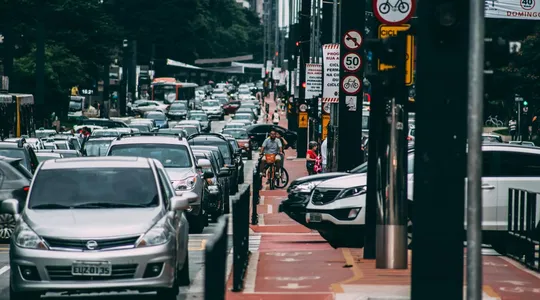 Urban street scene with heavy traffic and