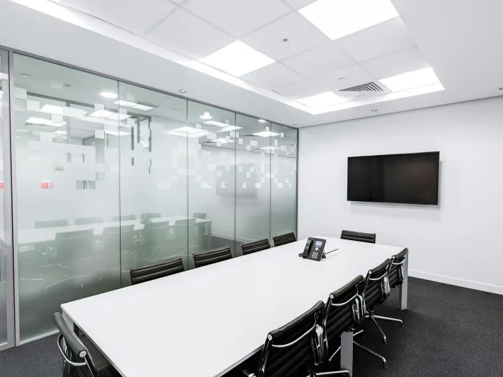Sleek, minimalist conference room with glass