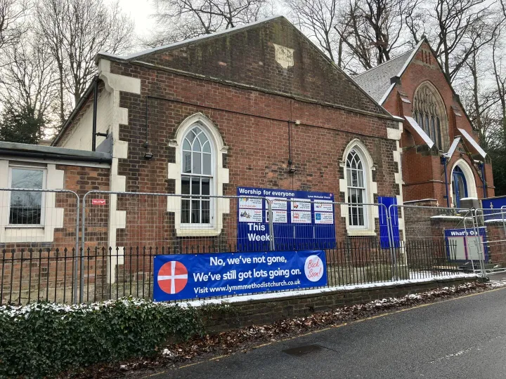 Building With Fencing and Banner