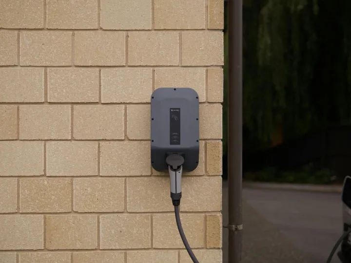 A wall-mounted electric vehicle charging station