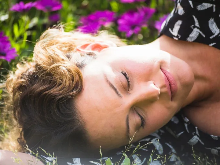 Pretty woman sleeping in garden