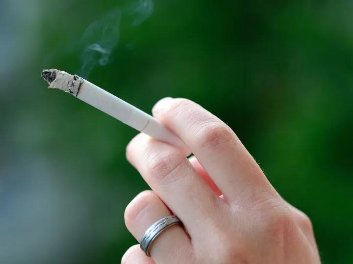 "Hand of smoking person"