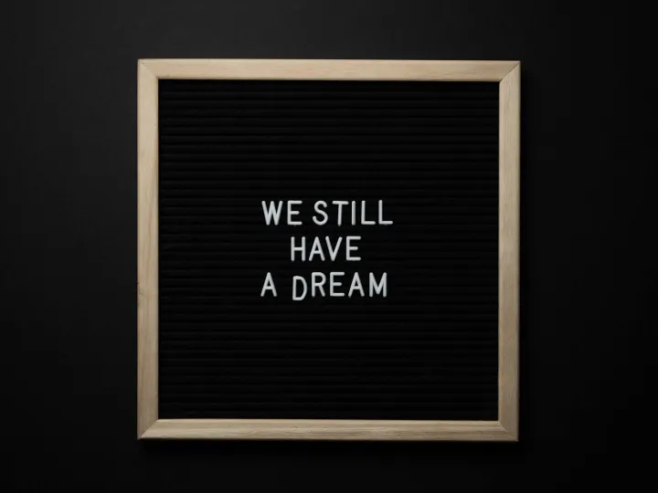 A black letterboard featuring the phrase 'We