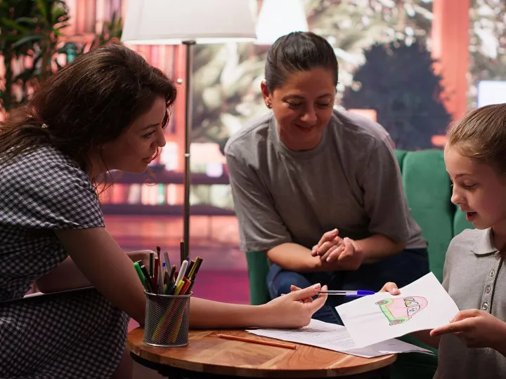 Teen girl participates in a drawing activity as part of psyc