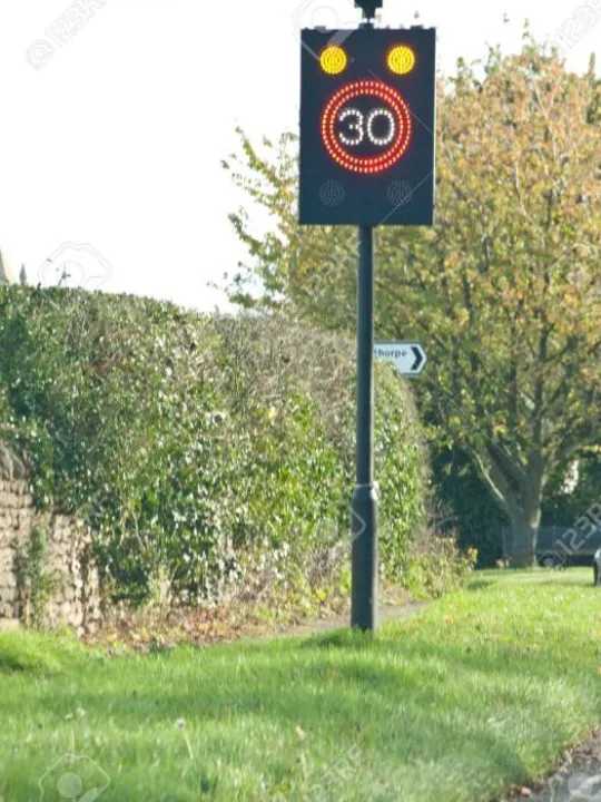 30mph-flashing-speed-limit-sign-on-a-typical-british-road