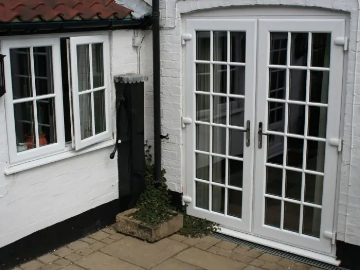 French doors with white brick courtyard