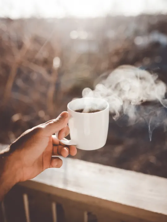 steaming coffee mug clay-banks-_wkd7XBRfU4-unsplash