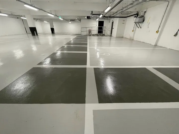 Glossy underground parking lot with marked spaces