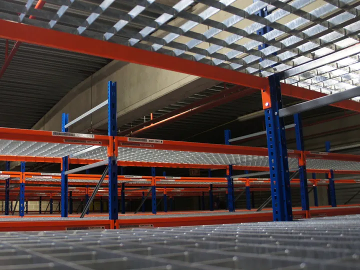 Newly painted warehouse shelving with blue columns and red beams