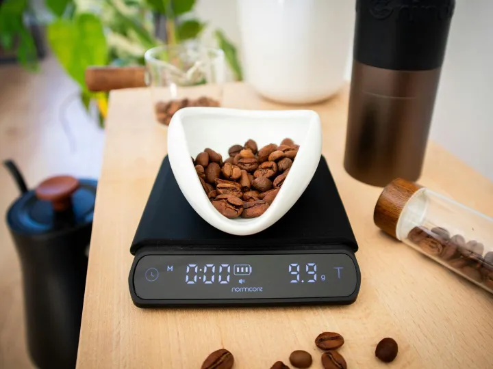 A digital scale with coffee beans, ideal for preci