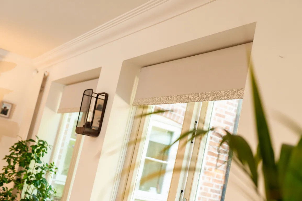 Peach blinds on peach wall