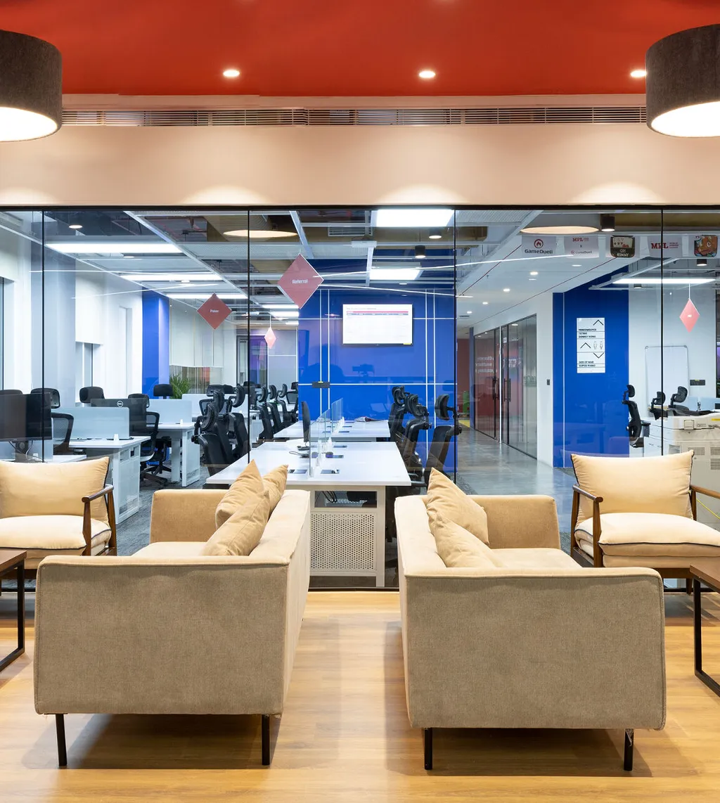 Office seating area with glass walls and plants