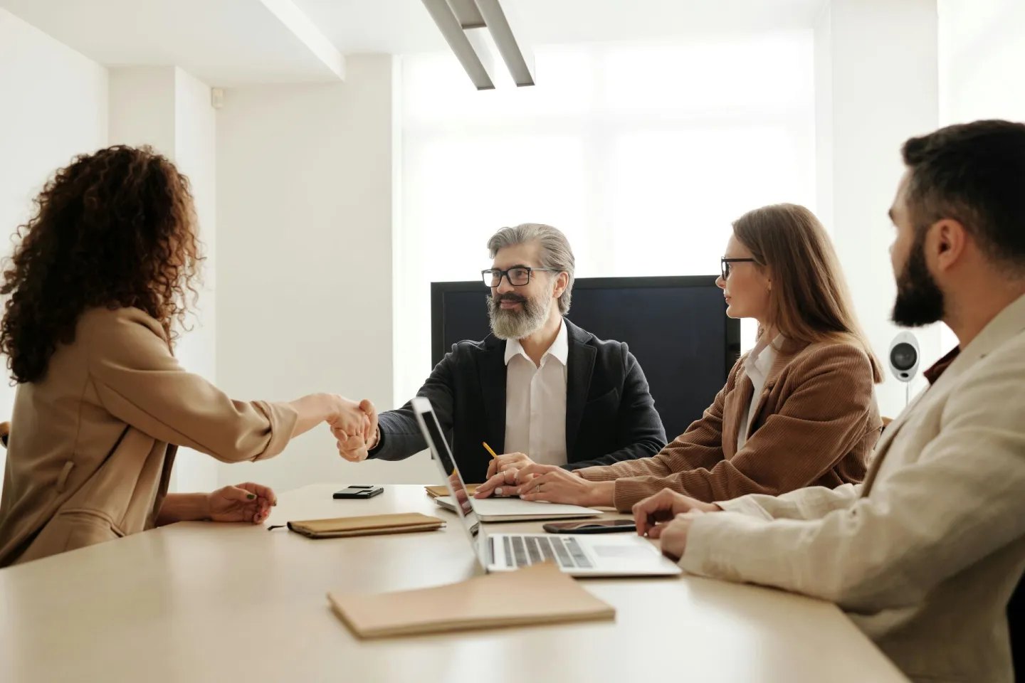 Colleagues in an office celebrating a successful