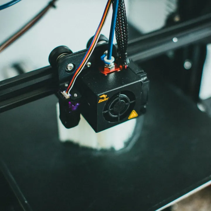 Detailed shot of a 3D printer creating an object,