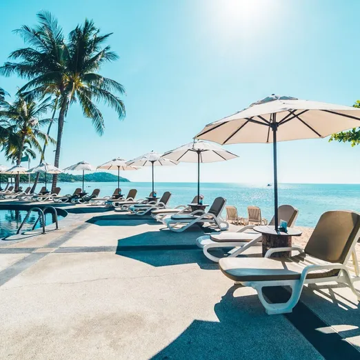 Beautiful tropical beach and sea with umbrella