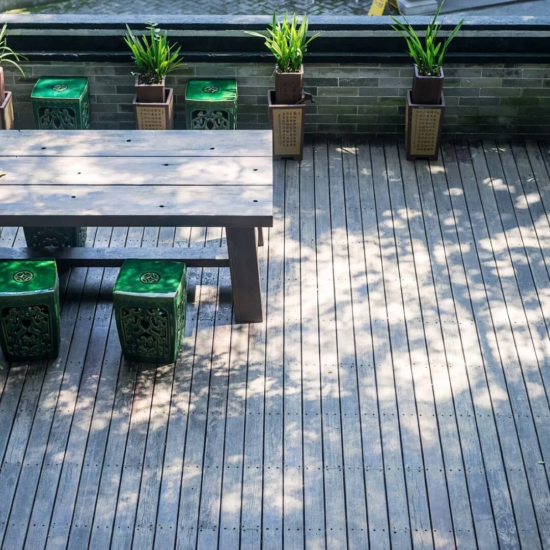Terrace with a wooden table and plants