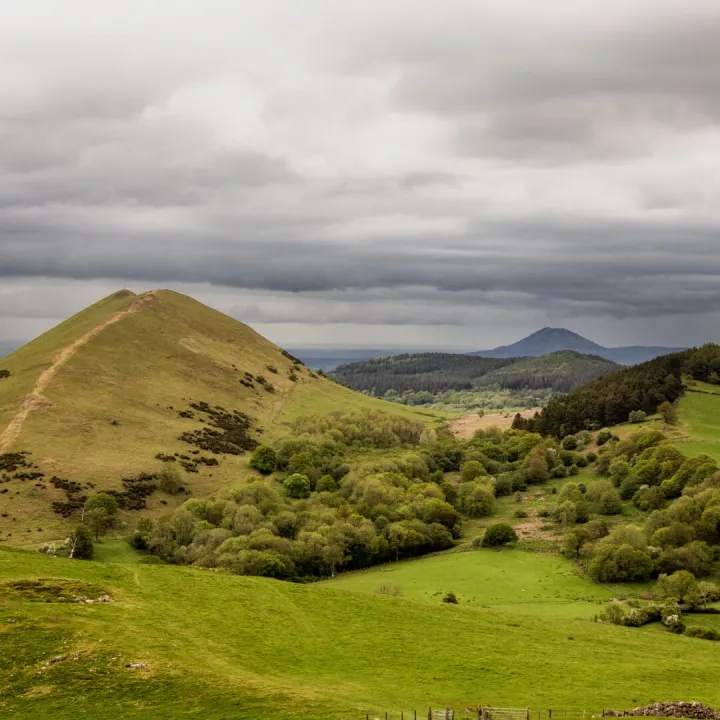 Rolling Shropshire hills under a stormy sky