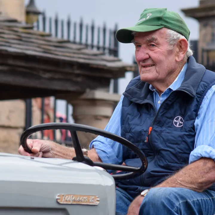 A Proud Tractor Owner in The Vehicle Parade