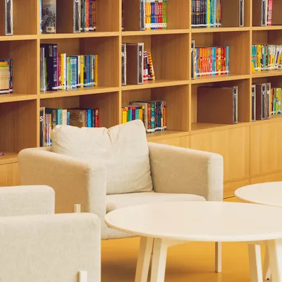 School library area with tables and chairs