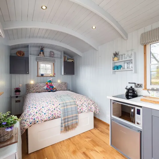 Inside the Shepherd’s Crook with its double bed and kitchen