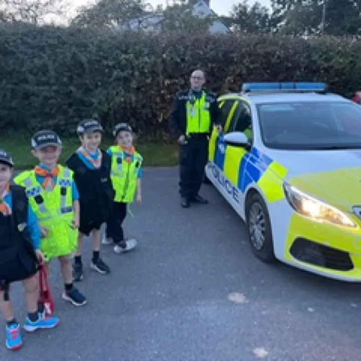 Beavers outside police car Oct 2023 Photo 2023 10 09 20 28 50